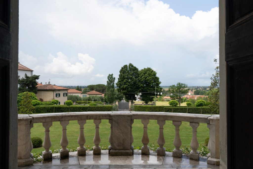 Panoramic view showcasing distant Pisa from Villa Lungomonte.
