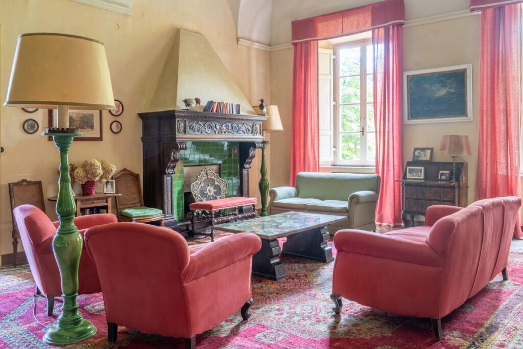 Spacious common room with historic detailing in Villa Lungomonte.